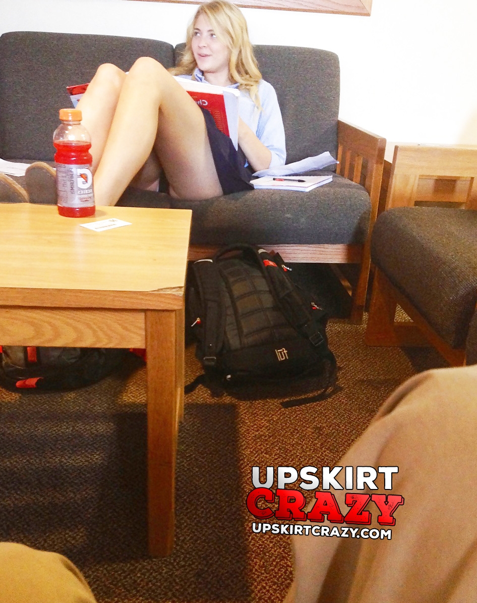 Upskirt of schoolgirl doing homework